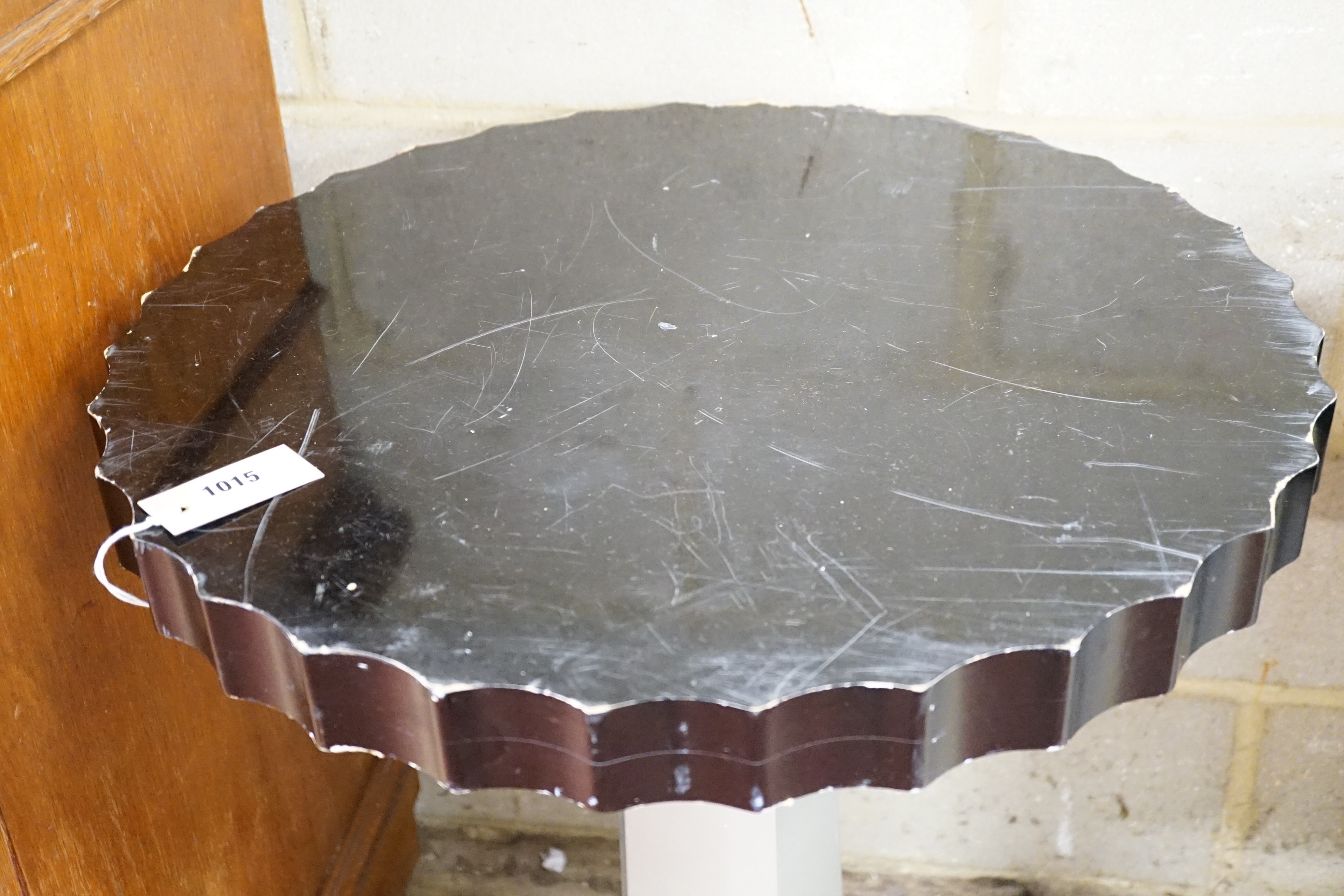 A pair of Art Deco ebonised and silvered wood occasional tables, diameter 60cm, height 71cm